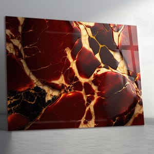 May include: A rectangular decorative panel with a glossy finish. The design features a pattern of deep red, black, and gold veining, resembling a polished stone. The panel is displayed against a neutral gray background.