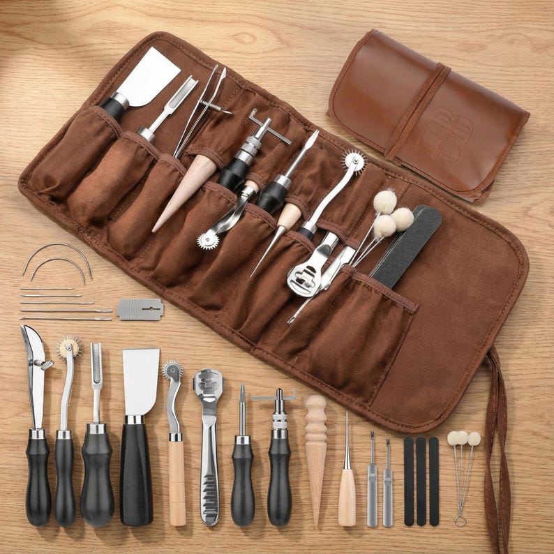 May include: A brown leathercraft tool kit with various tools, including knives, awls, and stitching tools. The tools are arranged in a brown roll-up case and a separate brown pouch. The tools have black and wooden handles.