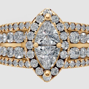 May include: A gold ring featuring a marquise-cut diamond at the centre, encircled by smaller round diamonds. The band has multiple rows of round diamonds, giving a sparkling, luxurious appearance. The ring is set against a light background.