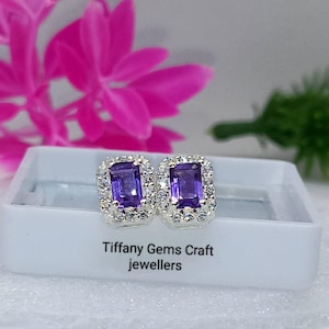 May include: A set of three ceramic mugs with a speckled, matte finish in cream, light grey, and dark grey. Each mug has a simple, modern design and a rounded handle. Ideal for tea or coffee.