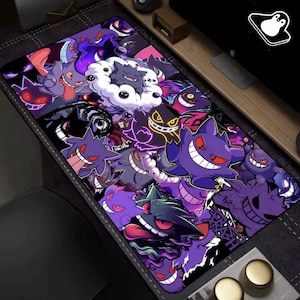 May include: A rectangular mousepad featuring a collage of purple cartoon ghost characters with red eyes and wide smiles. The design includes various shades of purple, black, and white, creating a vibrant and playful aesthetic.