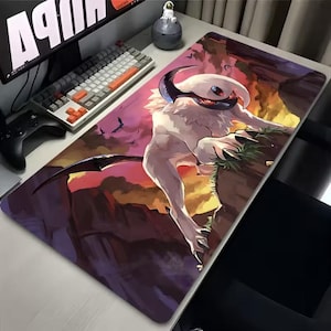 May include: A rectangular gaming mouse pad featuring a fantasy creature with white fur, black horns, and a red eye. The artwork depicts the creature on a rocky cliffside with a sunset background. The pad is designed for use with a computer mouse.