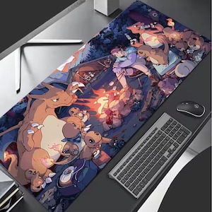 May include: A rectangular mousepad featuring a colorful illustration of a campfire scene with cartoon characters. The pad has a dark background with a keyboard and mouse visible on the right side.