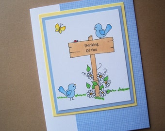 Birds with Flowered Sign Thinking of You Card
