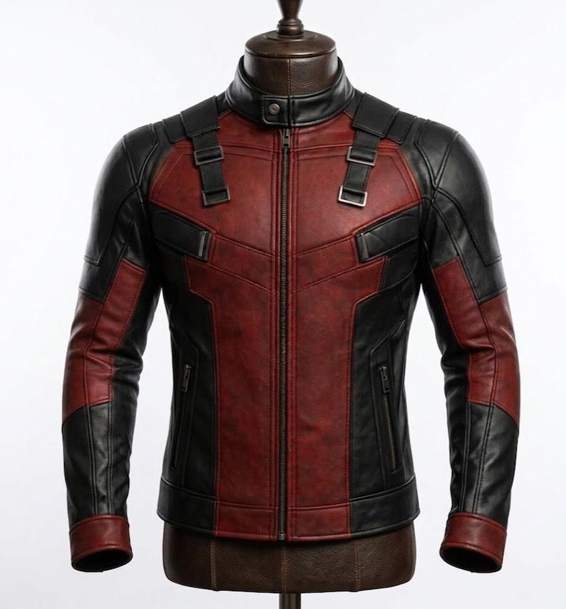 May include: A red and black leather jacket with a stand-up collar and a front zipper. The jacket has black panels on the shoulders and sleeves, with red panels on the chest and torso. The jacket is displayed on a mannequin.