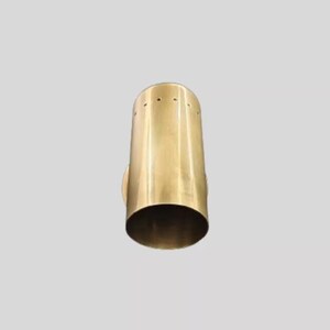 May include: A cylindrical, brass-colored wall sconce with a flared base. The sconce has a series of small holes near the top and a circular mounting plate on the side. The design is minimalist and modern.