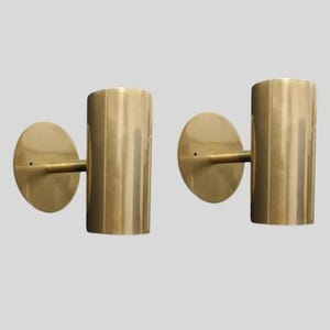 brass wall sconce
brass cylinder wall sconce
modern wall sconce
minimalist wall light
brass wall light
cylinder wall light
mid century wall sconce
brass tube wall light
modern brass lighting
wall sconce pair
luxury wall lighting
contemporary wall light
designer wall sconce
bedroom wall lighting
hallway wall light
hotel style wall lamp
indoor wall lighting
metal wall sconce
modern home lighting
decorative wall light
wall light fixture
brass lighting fixture