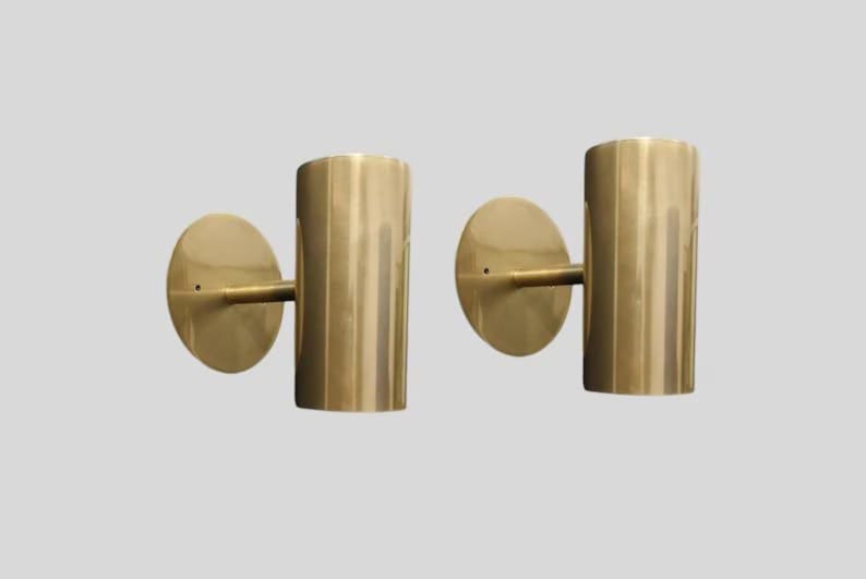 brass wall sconce
brass cylinder wall sconce
modern wall sconce
minimalist wall light
brass wall light
cylinder wall light
mid century wall sconce
brass tube wall light
modern brass lighting
wall sconce pair
luxury wall lighting
contemporary wall light
designer wall sconce
bedroom wall lighting
hallway wall light
hotel style wall lamp
indoor wall lighting
metal wall sconce
modern home lighting
decorative wall light
wall light fixture
brass lighting fixture