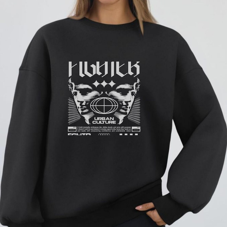 May include: Black sweatshirt with a white graphic design. The design features two stylized faces, a globe, and the words "URBAN CULTURE" in a bold font. Additional text is printed below the graphic.