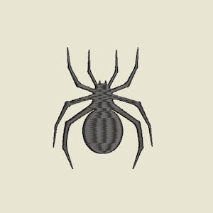 May include: A detailed, embroidered spider design in shades of gray, featuring a rounded abdomen and eight slender legs. The spider is centered on a cream-colored background, creating a striking contrast. The design is suitable for apparel or craft projects.