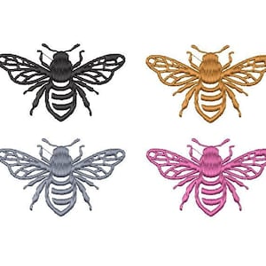 May include: Four embroidered bee designs in black, gold, gray, and pink. Each bee has a detailed outline and a striped abdomen.