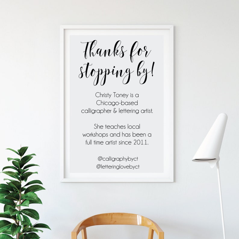 May include: A framed print with the text "Thanks for stopping by!" in elegant calligraphy. The print also includes information about Christy Toney, a Chicago-based calligrapher and lettering artist, and her social media handles.