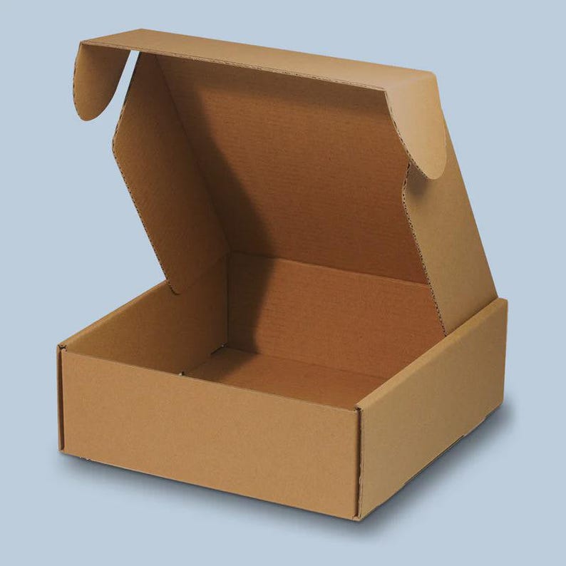 May include: An open, brown cardboard box with a hinged lid. The box is rectangular with a square base and is made of corrugated cardboard. The lid is partially open, revealing the interior of the box. The box is empty and sits against a light blue background.