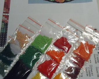 May include: Eight small bags of colorful beads, each labeled with a chart number and bead count. The beads are for diamond painting.