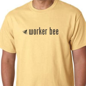 May include: A yellow t-shirt with a black bee graphic and the text "worker bee" printed on the front.