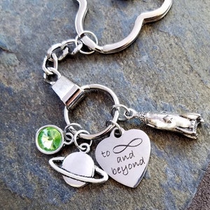 Personalized To Infinity and Beyond Buzz Lightyear Toy Story Movie Inspired Charm Keychain Rocket ship Planet Green Rhinestone Keyring