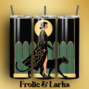 May include: Black tumbler with a gold and green art deco design. The design features a woman walking a black panther, with a yellow moon in the background. The text "Frolic & Larks" is at the bottom. Includes a black straw.