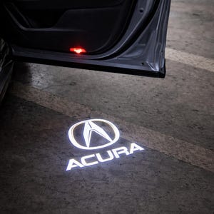 May include: A set of three ceramic mugs with a speckled, matte finish in cream, light brown, and dark brown. Each mug has a simple, minimalist design and a rounded handle.