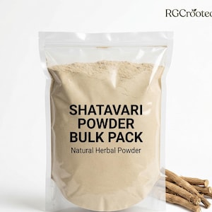 May include: A transparent plastic bag containing light brown Shatavari powder. The bag is labelled "SHATAVARI POWDER BULK PACK Natural Herbal Powder". Dried Shatavari roots are visible on the right.