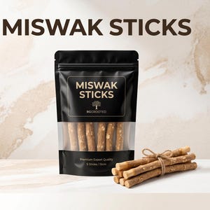 May include: A black stand-up pouch labeled MISWAK STICKS with a clear window showing several light brown wooden sticks inside. The pouch text reads Premium Export Quality 5 Sticks / 15cm. A bundle of five similar wooden sticks tied with twine sits nearby.