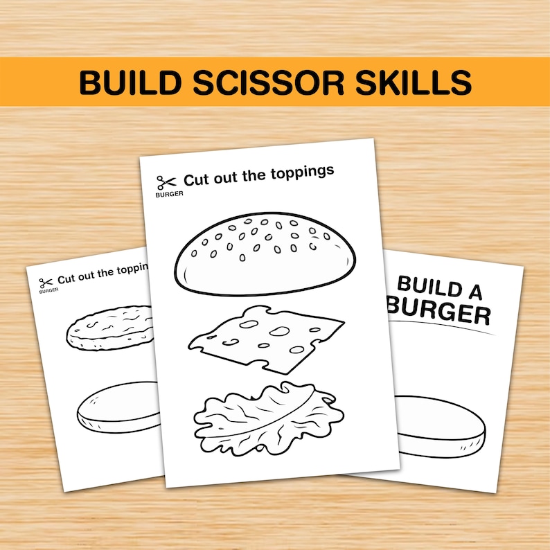 Pu&ograve; includere: Disegni a tratto in bianco e nero di componenti per hamburger su carta bianca. Il testo "BUILD SCISSOR SKILLS" &egrave; in alto. Sono visibili anche i testi "Cut out the toppings" e "BUILD A BURGER".