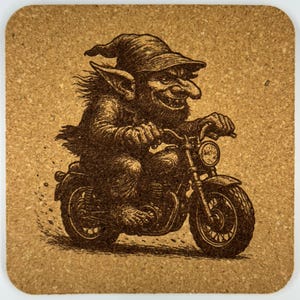 May include: A square cork coaster featuring a detailed illustration of a goblin riding a motorcycle. The goblin is wearing a hat and has a large nose. The motorcycle has a round headlight and a detailed engine. The coaster is brown.