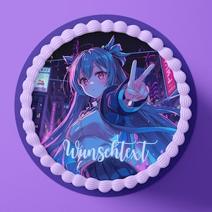May include: A round cake with a purple base and white frosting border. The cake features an anime-style illustration of a character with blue hair and pink eyes, giving a peace sign. The text "Wunschtext" is written on the cake.