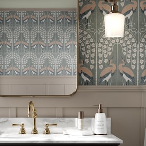 May include: A bathroom vanity with a white countertop and a gold faucet. The walls are covered in a patterned wallpaper featuring a repeating design of birds and flowers. A gold towel rack is on the right side of the vanity.