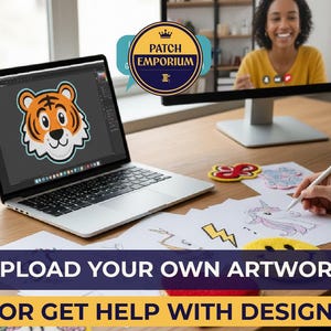 May include: A laptop screen shows a cartoon tiger patch design. The image includes the text "UPLOAD YOUR OWN ARTWORK OR GET HELP WITH DESIGN" and a logo that says "PATCH EMPORIUM". A person is drawing on paper with a stylus.