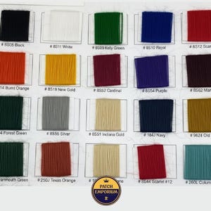 May include: A colour chart showcasing a range of thread colours, including black, white, green, and red. Each colour is labelled with a number and name, like "#8S05 Black" and "#8S11 White". The chart also features a "Patch Emporium" logo.