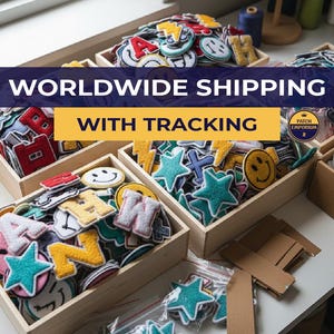 May include: Wooden boxes overflowing with colourful embroidered patches in various shapes, including letters, stars, and smiley faces. The patches are in a variety of colours, including red, blue, yellow, and green. The image also includes the text "WORLDWIDE SHIPPING WITH TRACKING".