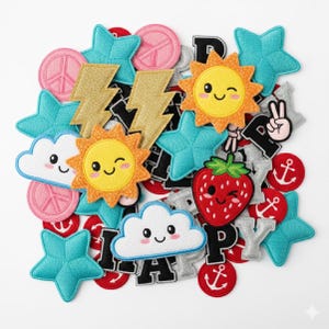 May include: A selection of embroidered patches in various shapes and colours. Includes blue stars, pink peace signs, gold lightning bolts, smiling suns, a winking strawberry, and clouds. The word "HAPPY" is spelled out with letter patches, and red anchor patches.