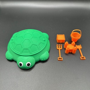 Turtle Sandbox with sand tools