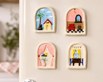 May include: Four arched, hand-painted ceramic magnets featuring miniature interior and exterior scenes. One shows a palm tree and dog house, another a room with a red chair, a third with pink curtains and a vase, and the last a dining table set.