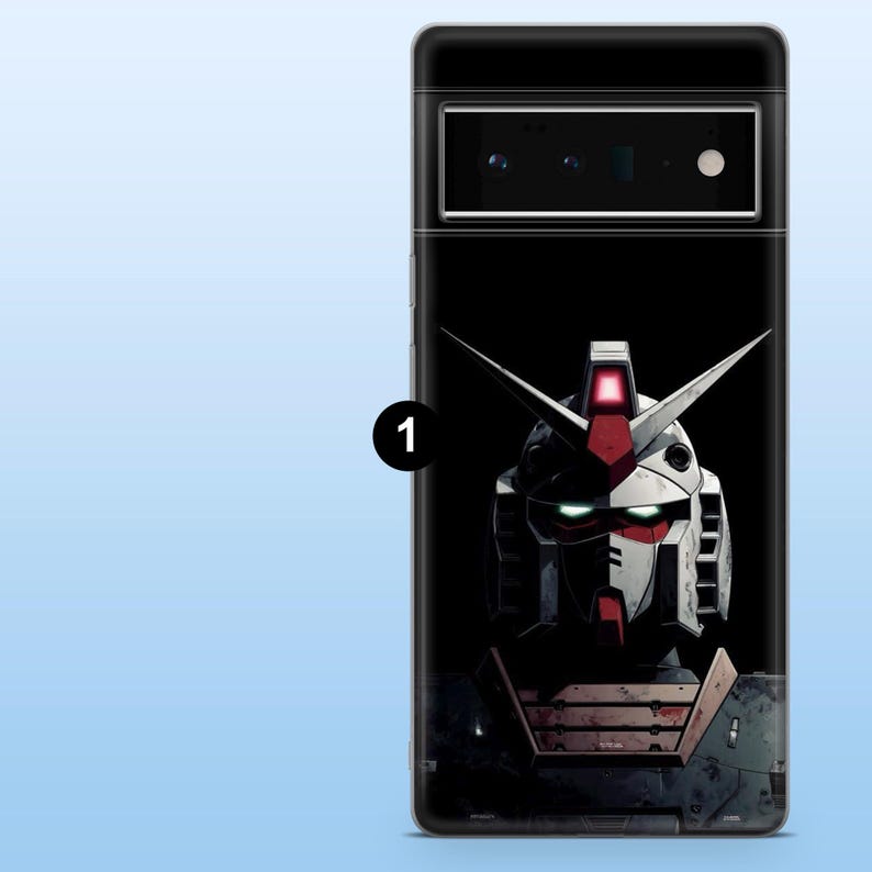 May include: A black phone case featuring a detailed illustration of a robot's head. The robot has a white and red color scheme with sharp, angular features and glowing green eyes. The case is designed for a phone.