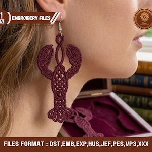 May include: A burgundy lobster-shaped earring is shown, with intricate macrame detailing. The earring is suspended from a silver hook. The image also includes text that says "EMBROIDERY FILES".