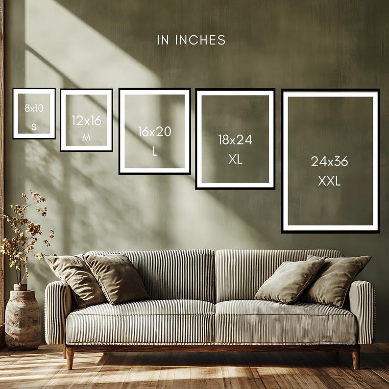 a living room with a sofa and a potted plant. The sofa has a striped pattern, and there are four framed pictures of different sizes displayed on the wall above it.