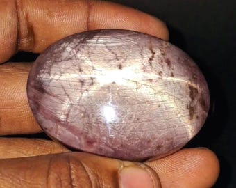 Zafiro estrella natural de 575,00 ct, cabujón ovalado, cristal sin tratar para protección e intuición.
