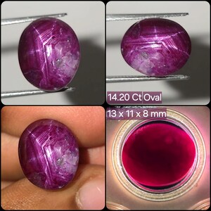 May include: An oval-shaped star ruby gemstone with a deep magenta hue and visible internal inclusions. The stone weighs 14.20 carats and measures 13 x 11 x 8 mm. The surface displays a distinct star-like optical phenomenon under direct light.
