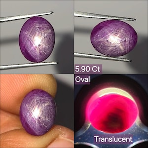 May include: An oval-shaped, translucent purple star ruby gemstone weighing 5.90 carats. The stone displays a distinct six-rayed star effect across its cabochon surface. The image includes text labels stating 5.90 Ct, Oval, and Translucent.