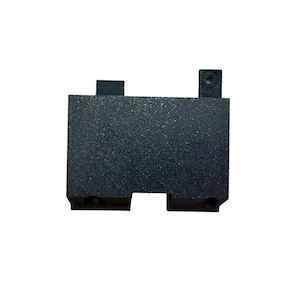 May include: A small, rectangular, black plastic component with a textured surface. It features two small protrusions on the top and a recessed area at the bottom. The component has a screw hole on one of the protrusions.