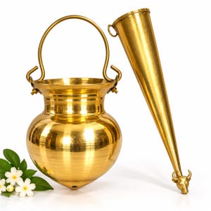May include: A polished brass pot with a rounded body, a wide rim, and a curved handle attached to two side loops. Beside it stands a long, slender, conical brass horn featuring a small metal ring at the top and a sculpted bull head at the base.