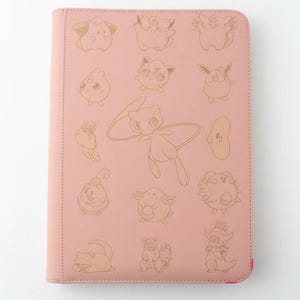 May include: A pink binder featuring gold-colored illustrations of various cartoon characters. The binder has a stitched border and a pink interior edge. The characters are arranged in rows and columns across the front cover.