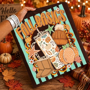 May include: A rectangular graphic print featuring the text FALL BASICS in orange letters. The design includes a tumbler with a floral pattern, a tan knit beanie, a pair of tan boots, and orange pumpkins against a teal and brown striped background.