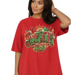 A woman wearing a red t-shirt with the text "JUNE TEENTH" and "1865" printed on it.