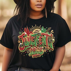 A woman wearing a black t-shirt with a colorful graphic design that says "JUNEEENUT 1865" on it.