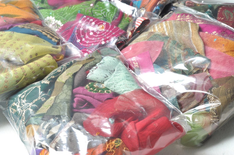 May include: Assortment of colorful fabric scraps in various textures and patterns, packaged in clear plastic bags.