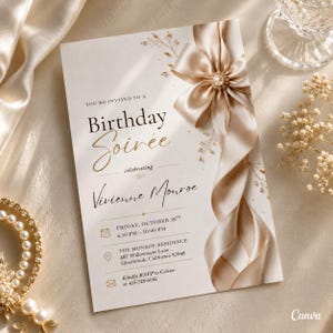 Op de afbeelding: Een rechthoekige verjaardagsuitnodiging met een grote, beige satijnen strik en een centrale parel. De tekst luidt: YOU'RE INVITED TO A Birthday Soirée celebrating Vivienne Monroe, Friday, October 18th, 6:30 PM – 10:00 PM, The Monroe Residence, 487 Willowmere Lane, Silverbrook, California 92048, Kindly RSVP to Celeste 415-728-6041.