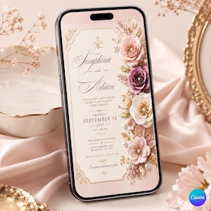 May include: A smartphone displaying a digital wedding invitation with a cream background, elegant script text, and a vertical arrangement of pink, purple, and white paper flowers accented with gold leaves and small white pearls along the right side.