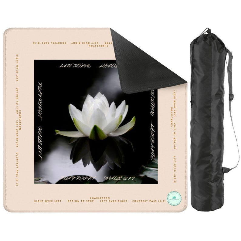 This is a mahjong mat. There is a peach border around the outside. Inside there is a black and white image of a lotus.